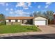 Charming single-story home with a well-maintained lawn, brick facade, attached garage and inviting curb appeal at 16246 E Hamilton Pl, Aurora, CO 80013