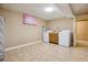 Functional laundry room includes washer, dryer, and cabinet space at 16246 E Hamilton Pl, Aurora, CO 80013