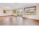 Spacious living room with tile flooring, natural light, and access to the backyard at 16246 E Hamilton Pl, Aurora, CO 80013