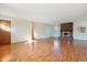 Spacious living room with hardwood floors, a brick fireplace and an open layout at 16246 E Hamilton Pl, Aurora, CO 80013