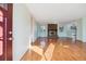 Inviting living room features hardwood floors, a brick fireplace and lots of natural light at 16246 E Hamilton Pl, Aurora, CO 80013