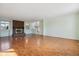 Spacious living room featuring a brick fireplace, hardwood floors and large windows at 16246 E Hamilton Pl, Aurora, CO 80013