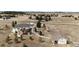 Aerial view of a home with a large lot, deck and a detached garage at 34942 Wagon Wheel Trl, Elizabeth, CO 80107