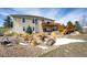 Beautiful backyard featuring a deck, patio, and a cozy fire pit area at 34942 Wagon Wheel Trl, Elizabeth, CO 80107
