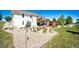 Exterior of a two-story home with a wooden deck and cozy fire pit area at 34942 Wagon Wheel Trl, Elizabeth, CO 80107