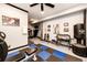 Well-equipped home gym featuring weights, treadmill, punching bag, and exercise equipment at 34942 Wagon Wheel Trl, Elizabeth, CO 80107