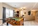 Finished basement featuring a cozy living area, a foosball table, and access to the outdoors for easy entertainment at 34942 Wagon Wheel Trl, Elizabeth, CO 80107