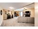 Spacious basement featuring a living area, foosball table, and wet bar, perfect for entertaining and relaxing at 34942 Wagon Wheel Trl, Elizabeth, CO 80107