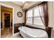 Relaxing bathroom showcasing a freestanding tub and stylish fixtures at 34942 Wagon Wheel Trl, Elizabeth, CO 80107
