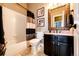Bathroom with a vanity with granite countertop and a shower-tub combination at 34942 Wagon Wheel Trl, Elizabeth, CO 80107