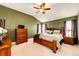 Comfortable bedroom features a high ceiling, ceiling fan, and natural light at 34942 Wagon Wheel Trl, Elizabeth, CO 80107