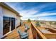Outdoor deck with comfortable seating, a grill, and scenic views, perfect for relaxing and entertaining guests at 34942 Wagon Wheel Trl, Elizabeth, CO 80107