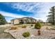 Beautifully landscaped single-Gathering home showcasing a well-maintained front yard and ample parking at 34942 Wagon Wheel Trl, Elizabeth, CO 80107