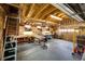 Well-organized garage interior with ample workspace, storage cabinets, and natural light at 34942 Wagon Wheel Trl, Elizabeth, CO 80107