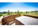 Private hot tub on a wooden deck, offering views of the surrounding green landscape at 34942 Wagon Wheel Trl, Elizabeth, CO 80107