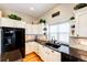 The kitchen showcases granite counters, stainless appliances, and ample storage at 34942 Wagon Wheel Trl, Elizabeth, CO 80107