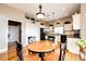 Charming kitchen features an island and an adjacent dining nook at 34942 Wagon Wheel Trl, Elizabeth, CO 80107