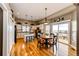 Bright kitchen boasts stainless appliances, center island, and adjacent dining area with deck access at 34942 Wagon Wheel Trl, Elizabeth, CO 80107