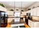 Spacious kitchen with granite countertops, sleek black appliances, and a center island at 34942 Wagon Wheel Trl, Elizabeth, CO 80107