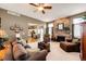 Inviting living area boasts a stone fireplace, comfortable seating, and an open layout at 34942 Wagon Wheel Trl, Elizabeth, CO 80107