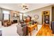 Cozy living room features a stone fireplace, plush furniture, and ample natural light at 34942 Wagon Wheel Trl, Elizabeth, CO 80107