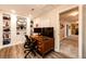 Home office with custom built-in bookshelves, desk with monitors and a rolling desk chair at 34942 Wagon Wheel Trl, Elizabeth, CO 80107