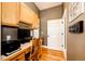 Efficient office space with built-in cabinets and wood flooring at 34942 Wagon Wheel Trl, Elizabeth, CO 80107