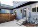 A private back porch offers seamless indoor/outdoor living at 11488 E 25Th Dr, Aurora, CO 80010