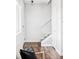 Welcoming entryway with hardwood floors, staircase, and neutral decor at 11488 E 25Th Dr, Aurora, CO 80010