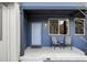 Charming front porch with seating, modern fixtures, and a well-manicured walkway at 11488 E 25Th Dr, Aurora, CO 80010