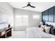 Bright main bedroom with large windows, a ceiling fan, and contemporary furnishings at 11488 E 25Th Dr, Aurora, CO 80010