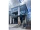 Modern two-story home with a covered porch, neutral paint scheme, and stone accents at 8859 Waterleaf Ln, Littleton, CO 80125