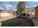 Backyard with detached garage, storage shed, and fenced area at 2640 S York St, Denver, CO 80210