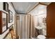 Basement bathroom with a shower/tub combo, toilet, and pedestal sink at 2640 S York St, Denver, CO 80210