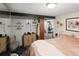 Basement bedroom with a pink comforter and en-suite access at 2640 S York St, Denver, CO 80210