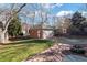 Detached brick garage with a large backyard and patio at 2640 S York St, Denver, CO 80210