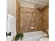 Bathroom showcasing decorative tile accents in a shower/tub combination at 9283 E Arbor Cir # C, Englewood, CO 80111