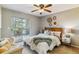 Charming bedroom with a cozy bed, a ceiling fan, and a private outdoor balcony at 9283 E Arbor Cir # C, Englewood, CO 80111