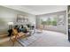 Cozy living room featuring large window allowing ample natural light to fill the space at 9283 E Arbor Cir # C, Englewood, CO 80111