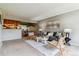 Comfortable living area with stylish furniture flowing into the dining space and kitchen at 9283 E Arbor Cir # C, Englewood, CO 80111