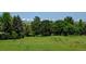 Expansive backyard with a lush lawn and picturesque views of the snow capped mountains in the background at 2937 W Yarrow Cir, Superior, CO 80027