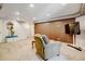 Large finished basement showcasing a comfortable seating area and entertainment setup with ample lighting at 2937 W Yarrow Cir, Superior, CO 80027