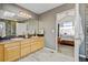 Bathroom features double sinks, tiled backsplash, neutral paint, and access to the main bedroom at 2937 W Yarrow Cir, Superior, CO 80027