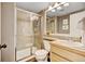 Bathroom features a glass shower, neutral paint and light wooden vanity at 2937 W Yarrow Cir, Superior, CO 80027