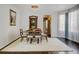 Bright dining room features a dining table set, hardwood floors, and an elegant chandelier at 2937 W Yarrow Cir, Superior, CO 80027