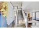 Elegant foyer with hardwood floors, a staircase, and a view into the dining room at 2937 W Yarrow Cir, Superior, CO 80027