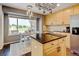 Bright kitchen featuring granite countertops, stainless steel appliances, and a breakfast nook overlooking the backyard at 2937 W Yarrow Cir, Superior, CO 80027
