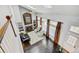 Aerial view of a living room with a vaulted ceiling, lots of natural light, and fireplace with decorative accents at 2937 W Yarrow Cir, Superior, CO 80027