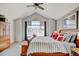 Main bedroom features high ceilings, neutral paint, a ceiling fan, and windows to let in natural light at 2937 W Yarrow Cir, Superior, CO 80027