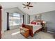 Main bedroom features high ceilings, neutral paint, a ceiling fan, and natural lighting at 2937 W Yarrow Cir, Superior, CO 80027